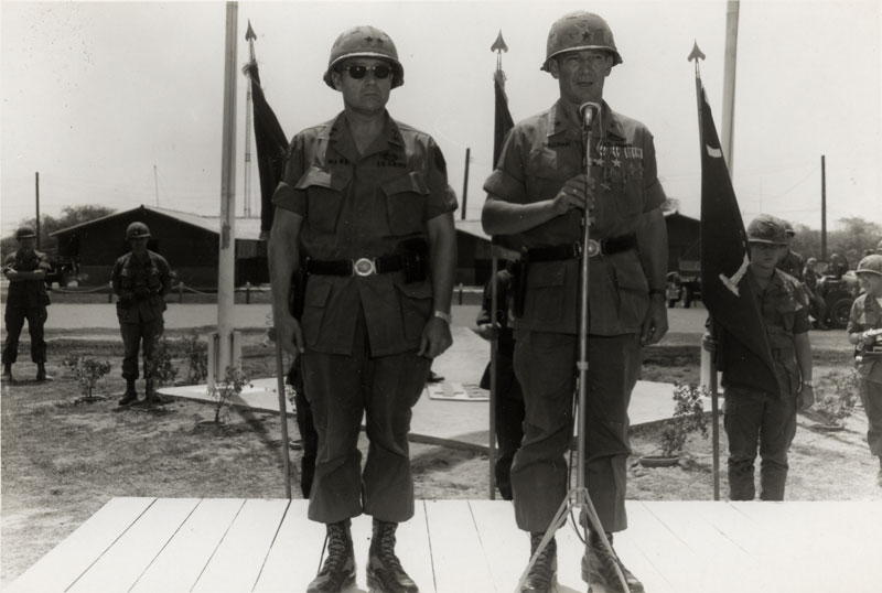 Major General Keith Ware presents Brigadier General William S. Coleman with awards.